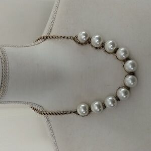 Women's white pearl beaded necklace wrapped in gold tone chain
